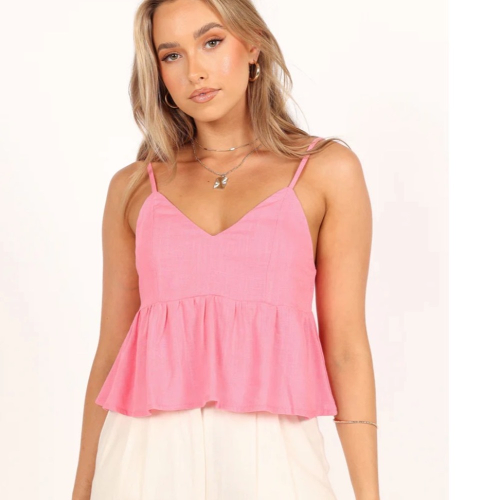 cropped length
back tie close
back cut out feature